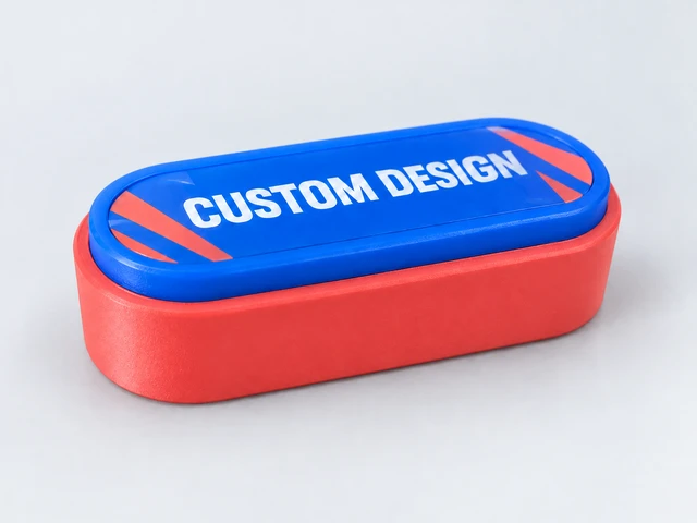 Illustrative coral button body with cobalt-blue frame and CUSTOM DESIGN promotional artwork